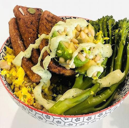 Vegan Buddha Bowl : Seared tofu steaks, sauerkraut, spiced roasted chickpeas, steamed broccolini, sautéed kale, avocado, roasted pine nuts topped with garlic tahini dressing (GF)  at Mr Booch in Mangerton