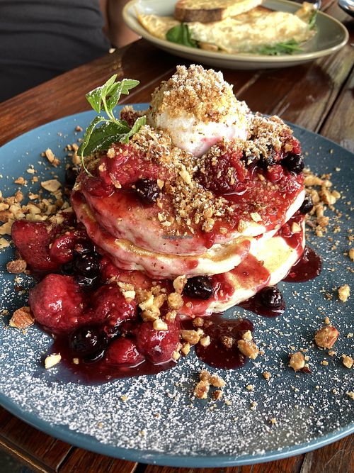 Vegan pancakes with berry coulis, nut crumble and vegan ice cream   at The Lillipad Cafe in Glebe