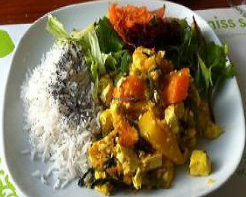 Cambodian curry with tofu, mango, pumpkin and lime leaves. And a cashew fruit and pineapple drink! Yum! at M Butterfly by Miss Saigon in Lisbon