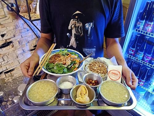 Updated menu 2020
Vegan set, 5 different local dishes cooked by street food vendors and our auntie Ngoc. noodles salads, banh mi, steamed rice cake w peanuts, bean poridge, cake.  at The Railway in Hanoi