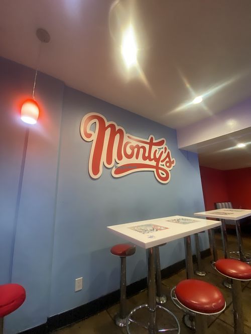 Interior - cute, some seating has seen better days   at Monty's Good Burger - Echo Park in Los Angeles