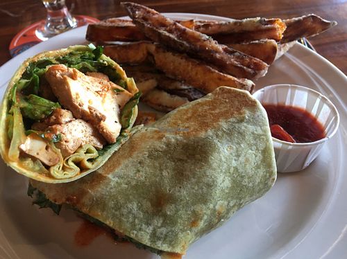 buffalo tofu wrap w sweet potato fries  at ION - It's Only Natural Restaurant in Middletown