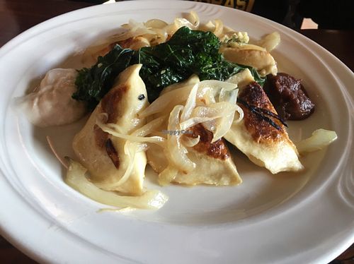 perogies w kale and sautéed onions w sc and apple butter on the side at ION - It's Only Natural Restaurant in Middletown