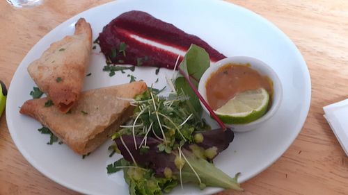 Vegetable samosas with salad, chutney and beetroot puree at Goji Vegetarian Cafe and Deli in York