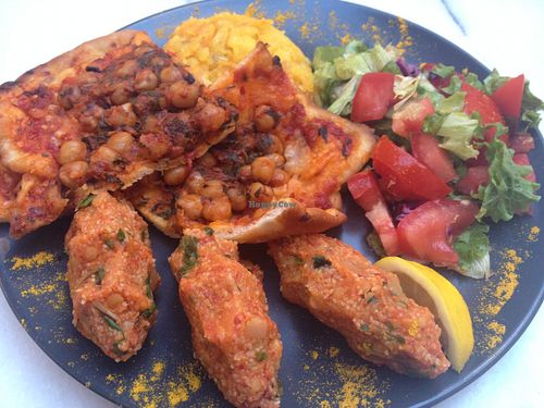 Vegan pizza and lentil balls with potato and salad at Hoş Atölye in Istanbul