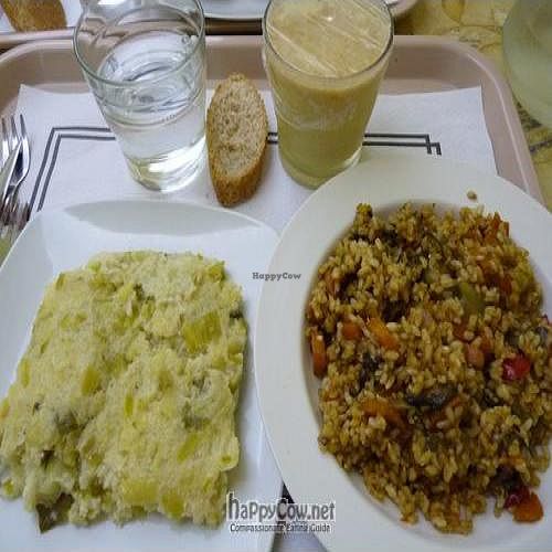 Millet and leek pudding, paella with vegetables, and fruit-soy milk smoothie. at La Olla Vegetal in Zaragoza