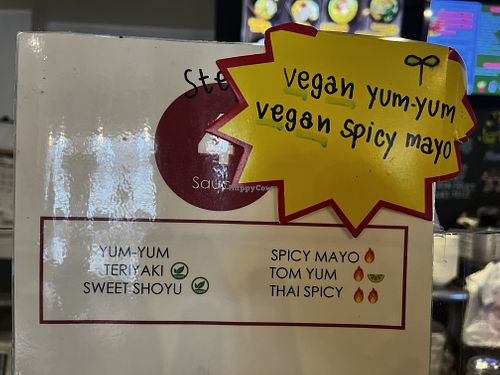 Explaining the sauces.  at Corner 11 Bowl and Wrap in Cleveland