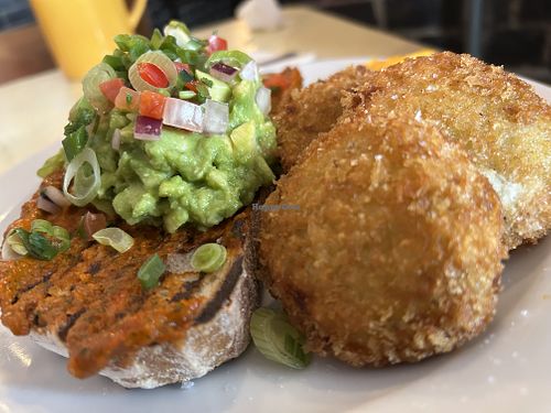 Avo on sourdough with breaded fried green tomatoes   at The Breakfast Club in East London