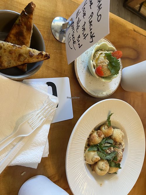 Ooo, sideways toast, hummus and garlic knots!  at Journey Cafe in Kailua Kona