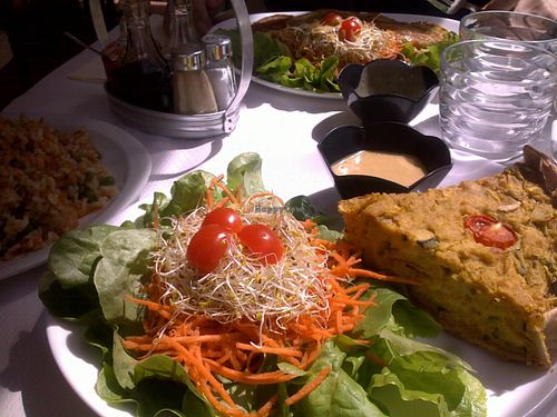 Quiche with salad and dressing and rice and peas at Loving Hut in Paris