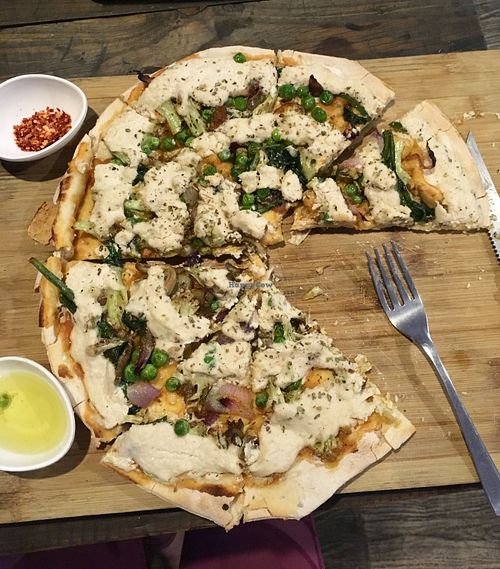 Vegan cheese pizza with peas, broccoli and spinach at Little Windows in Pokhara