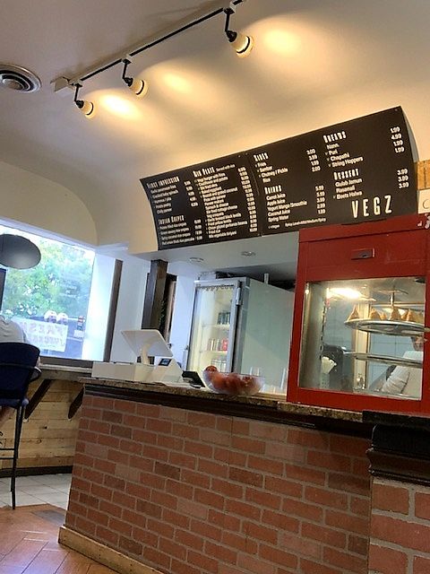 The front counter, some bar seating facing the window. at VEGZ in Washington