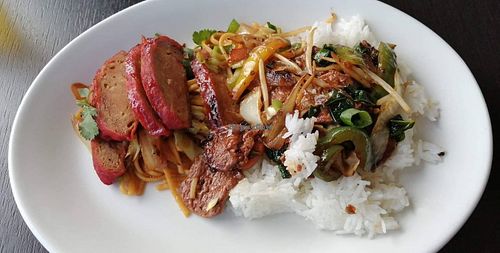 Char siu pork and the black bean with chili beef mixed together on a plate at Hoi-An in Bodmin