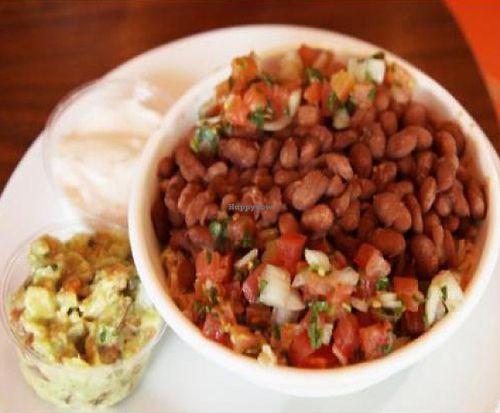 Rice bowl: brown rice, lettuce, pinto beans, salsa, guacamole, and vegan sour cream.  at Juicy Ladies in Woodland Hills