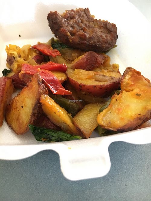 Potatoes with onions and peppers and veg sausage   at Lakeside Cafe in Orlando