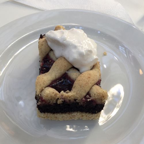 Blueberry pastry with whipped cream at Napfényes Restaurant & Confectionery in Budapest