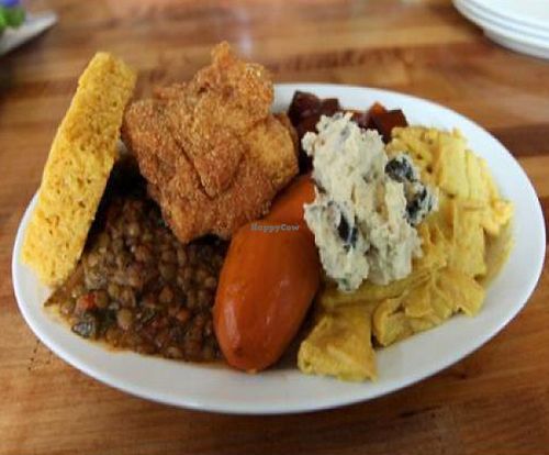 he everything plate: collard greens, cornbread, black eye peas, southern fried tofu, lentils, potato salad, bbq tofu, mac-n-cheese, and yams at Souley Vegan in Oakland