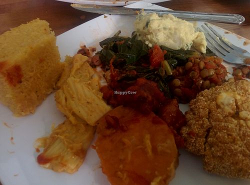 Sampler platter. cornbread, mac & cheese, yams, lentils, black eyed peas, potato salad, bar-b-q tofu, southern fried tofu, collard greens. at Souley Vegan in Oakland