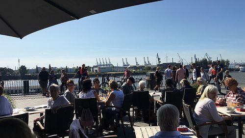 Outdoor seating with the view on the harbour at ALEX in Hamburg