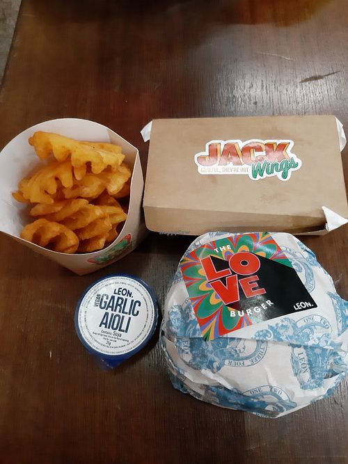 The love burger with fries and vegan aioli!! at LEON - Victoria Station in London