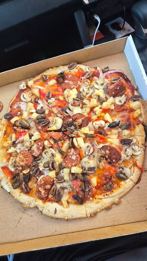 Vegetarian pizza made vegan and add vegan salami at Pluto's Pizza in Knoxfield