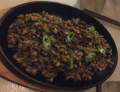 Delicious Filipino dish served with rice at The Cavern in El Nido