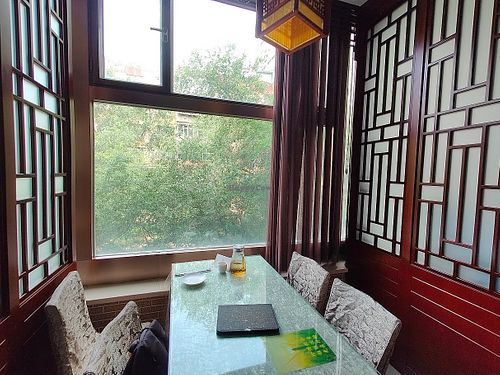 table with windows view.  at Yuanqi Vegetarian - 缘启妙膳 in Urumqi