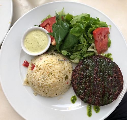 Beetroot and bean burger with vegetables rice and salad   at Mela Canela in Sintra