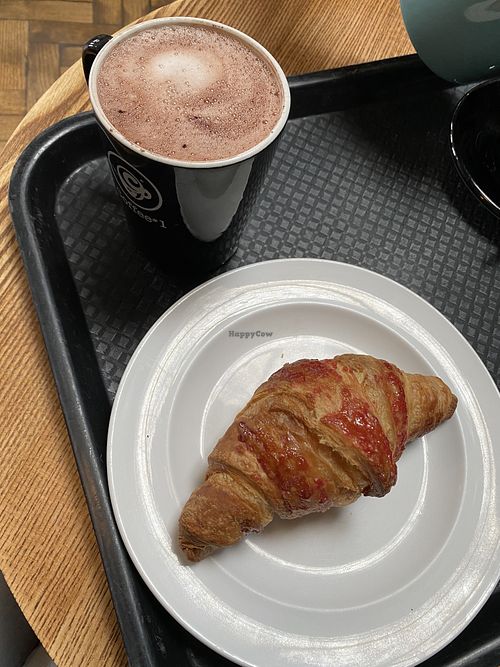 Hot chocolate with coconut milk and raspberry croissant  at Coffee #1 in Malmesbury