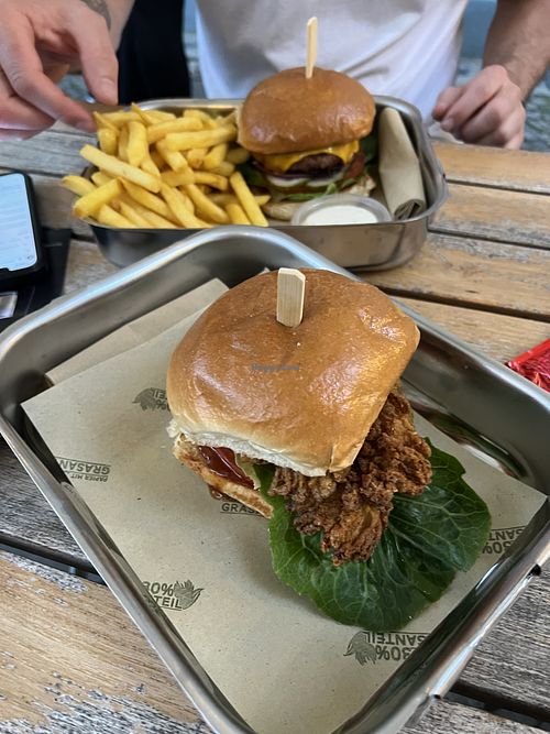 Fried chickens burger + spicy burger in the back   at Smokey Greens in Berlin