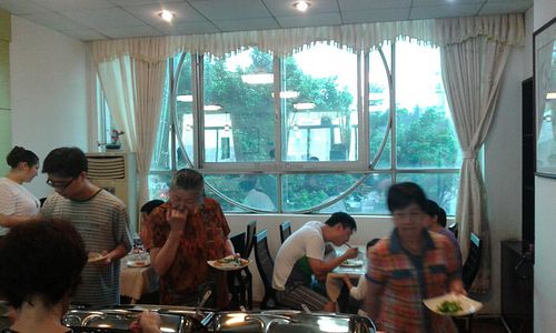 Two tables behind the buffet at Hong Shan Vegetarian - Saint Love in Guangzhou