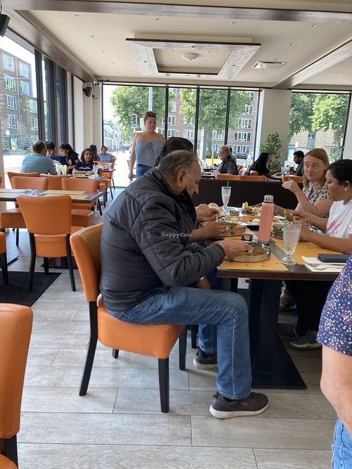 Seating. Many Indian customers  at Krishna Vilas in Utrecht