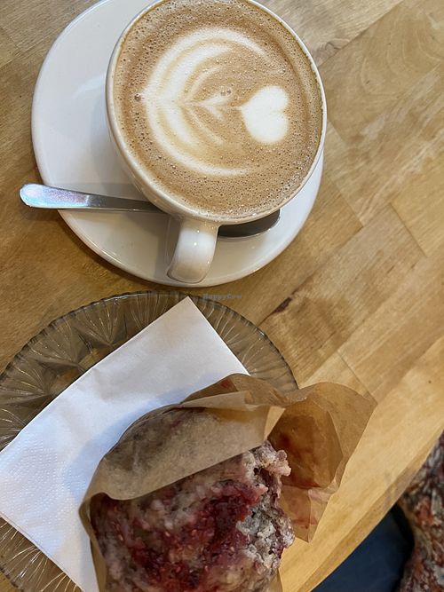 Pea milk cappuccino and banana raspberry coconut muffin  at Kawa in Poznan