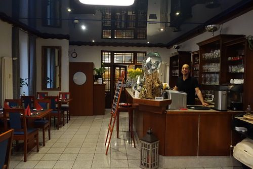 La Piazza restaurant from the inside, with Claudio, the happy vegan owner at La Cucina Verde in Friedrichsthal