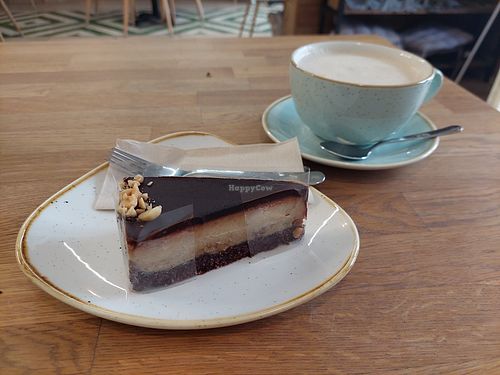 Chai latte and cake at Élelem Etterem in Budapest