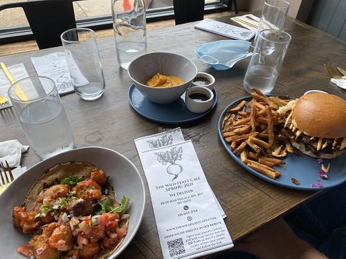 Vegan crispy cauliflower tacos and vegan sweet potato queso 😍 at The Wild Feast Cafe in Rockville Centre