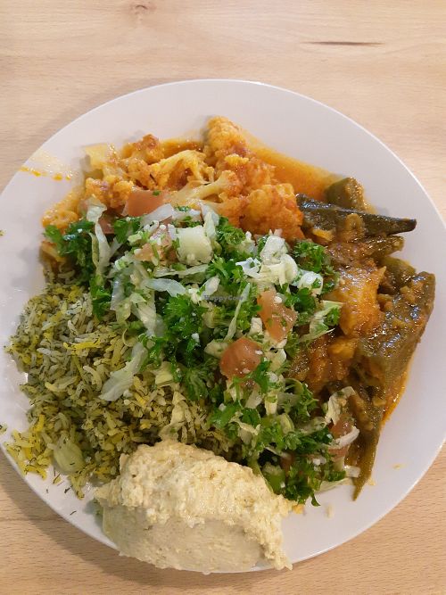 Buffet selection, $14 medium plate - herb rice, okra stew, cauliflower stew, salad and hummus at Eden Iranian Fusion Eatery in Wellington