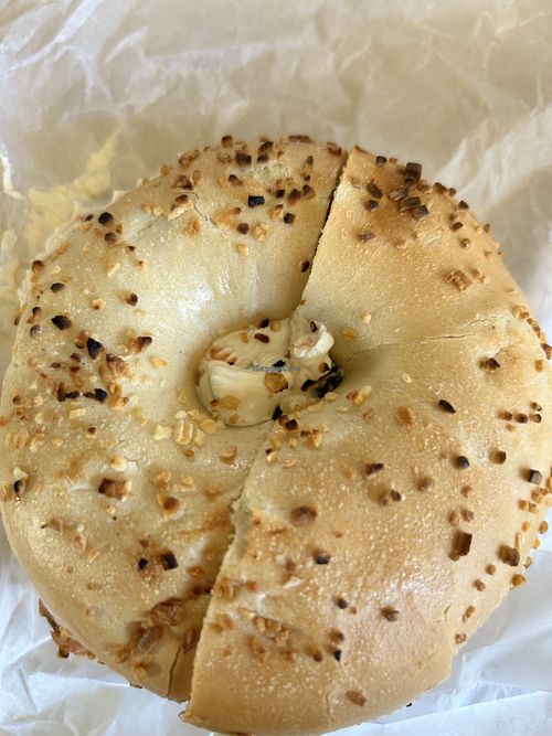 Onion toasted bagel with vegan veggie cream cheese  at Seaford Bagels in Seaford