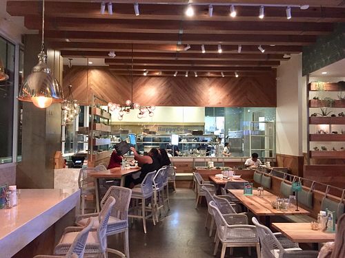 Stylish dining room with open kitchen in rear.  Ample outdoor dining also available. at Tocaya Modern Mexican - Fashion Square in Scottsdale