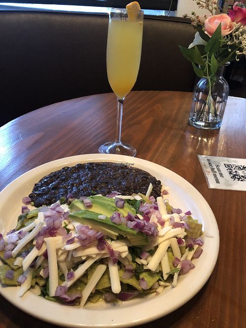 Vegan chiaquiles and mimosa. Yum! at Vegan Avenue in San Antonio
