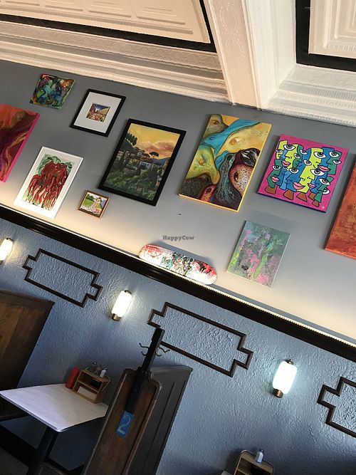 artwork from local artists for sale on the walls  at Gonzoburger in Charleston
