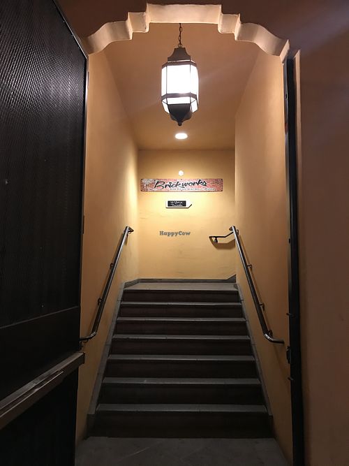 Entrance to restaurant on left of plaza  at Brickworks in Palm Springs