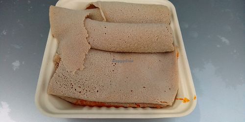 Ethiopian bread with tofu underneath it. at Nile Vegan in Columbus