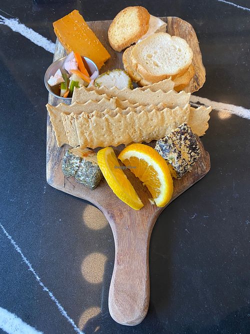 Sampler tray including brie, sun dried tomato herb fromage,
smoked cheddar, and
honee pistachio chevre
 at Rebel Cheese in Austin