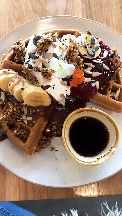 buckwheat waffles with nutella, raspberries, coconut yoghurt, crunchy buckinis and banana at Barefoot Eatery in Christchurch