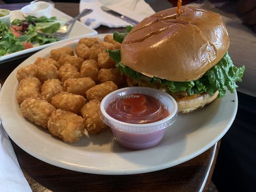 Impossible burger with tater tots  at Lake Alice Trading Co in Riverside