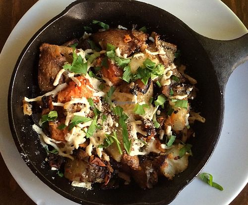 country yams and breakfast potatoes with daiya cheese  at Plum Bistro in Seattle