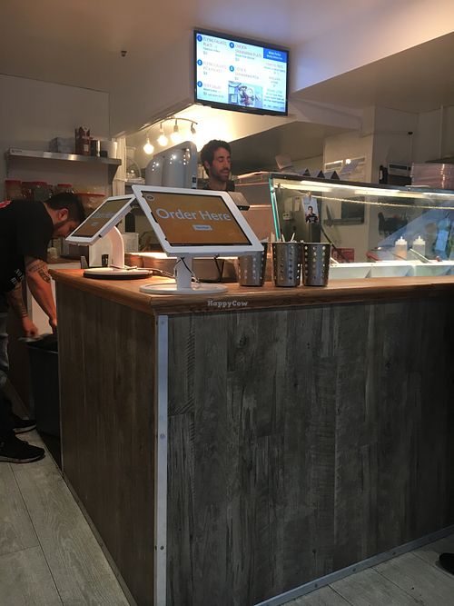 Nice fellow flipping the falafel. 🧆🥙 at The Flying Falafel - Financial District in San Francisco