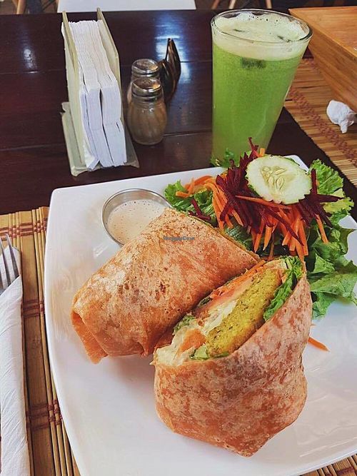 Vegan falafel and hummus wrap with sesame dressing at Mantras Veggie Cafe and Tea House in San Jose