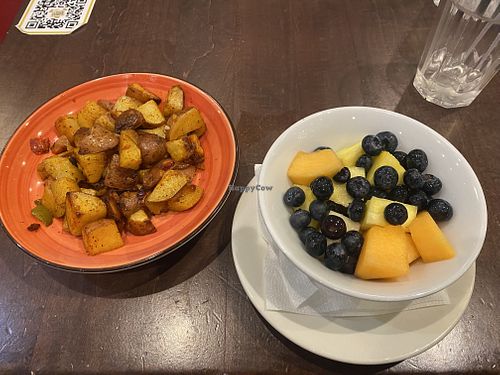 Breakfast (Side Potatoes and Fruit Bowl) 😜  at Busboys and Poets - Mount Vernon Triangle in Washington